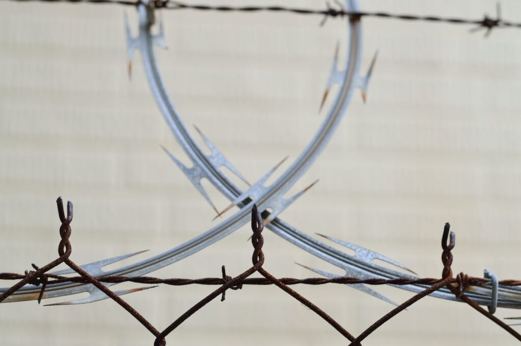 A barbed wire fence with two intersecting circles.